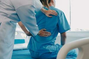 Patient doing some special exercises under supervision in a room photo