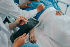 Injured patient showing doctor broken wrist and arm with bandage in hospital office or emergency room. Sprain, stress fracture or repetitive strain injury in hand. Nurse helping customer. First aid. photo