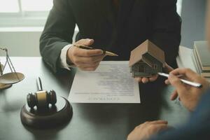 Lawyer, legal advisor, businessman brainstorming information on agreement details Business contracts in legal processing books for accuracy in contract documents. joint financial investment. photo
