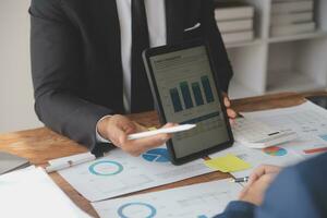 Team of business people working together in the meeting room office, teamwork background charts and graphs banner, double exposure successful teamwork,business planning concept. photo