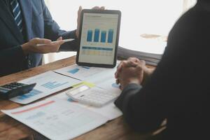 Team of business people working together in the meeting room office, teamwork background charts and graphs banner, double exposure successful teamwork,business planning concept. photo