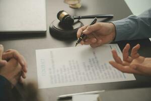 Lawyer, legal advisor, businessman brainstorming information on agreement details Business contracts in legal processing books for accuracy in contract documents. joint financial investment. photo