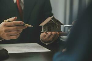Lawyer, legal advisor, businessman brainstorming information on agreement details Business contracts in legal processing books for accuracy in contract documents. joint financial investment. photo