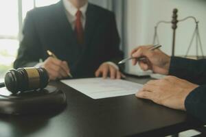 Lawyer, legal advisor, businessman brainstorming information on agreement details Business contracts in legal processing books for accuracy in contract documents. joint financial investment. photo
