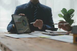 Team of business people working together in the meeting room office, teamwork background charts and graphs banner, double exposure successful teamwork,business planning concept. photo
