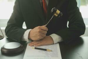 Lawyer, legal advisor, businessman brainstorming information on agreement details Business contracts in legal processing books for accuracy in contract documents. joint financial investment. photo