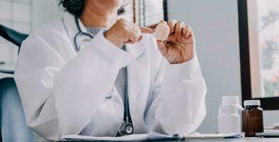 Female doctor holding virtual Lungs in hand. Handrawn human organ, copy space on right side, raw photo colors. Healthcare hospital service concept stock photo