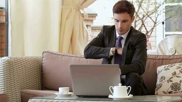 Modern businessman drinking espresso coffee in the city cafe video