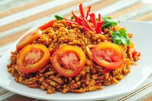 Sambel goreng tempe kering or Dried tempe fried chili sauce sliced into small pieces photo