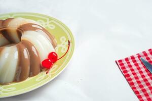 Jelly Pudding garnished with Cherry photo