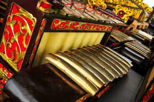 Gamelan is a traditional percussion musical instrument from Java, Indonesia made from brass plates lined up to form notes photo