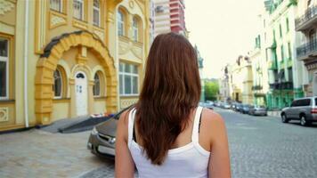 Attractive woman walking in a beautiful town video