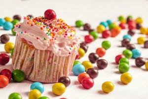 cupcake cherry with candies photo