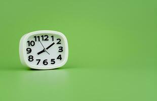 Modern alarm clock with clock hands standing still Working with time, being punctual, time is valuable to work and life. photo