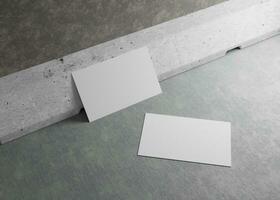 Business Cards Laying on a Wall Mockup photo