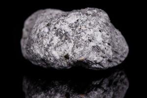 Macro mineral stone Pumice on black background photo