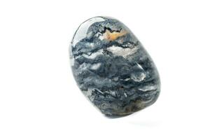 Macro mineral quartz stone with dumortierite on a white background photo