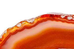 Macro mineral orange agate in crystals on white background photo