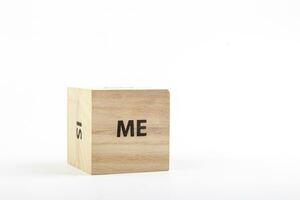 Wooden cubes with the inscription me on a white background photo
