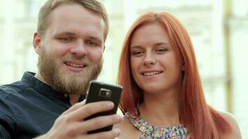 Couple taking picture of themselves video