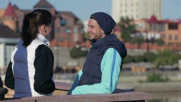 Man and woman talking before jogging video