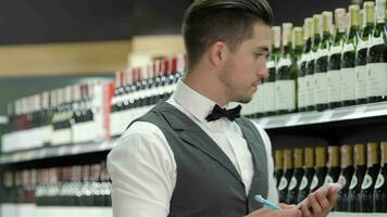 Side view of confident young sommelier video