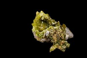 Macro Pyromorphite mineral stone on a black background photo