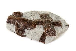 macro mineral stone Staurolite on a white background photo