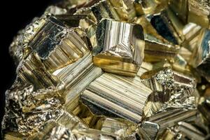 Macro mineral stone Pyrite on a black background photo