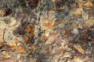 Raw granite rock texture background. photo