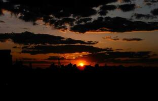 Autumn red sunset with a purple sky photo