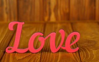 wooden inscription I love you on a wooden background photo