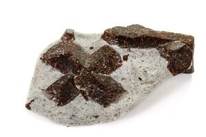 macro mineral stone Staurolite on a white background photo