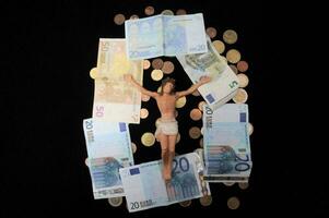 person on the cross surrounded by money photo