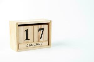 Wooden calendar January 17 on a white background photo