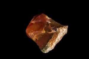 macro stone Carnelian mineral on a black background photo