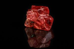 Macro mineral spinel stone on black background photo