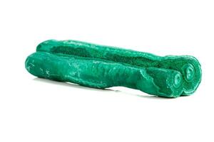 Macro mineral stone malachite stalactite on white background photo