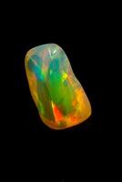 macro mineral stone rare and beautiful opals on a black background photo