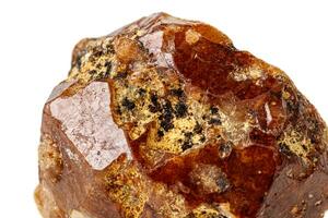 Macro stone Grossular mineral on white background photo