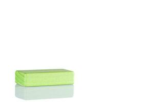 Wooden cube of green color on a white background photo