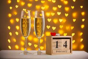 beautiful glasses of champagne on a blurred background of hearts photo