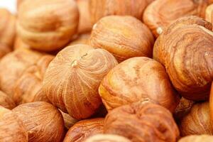 macro hazelnuts nuts on a white background photo