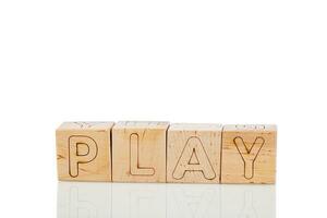 Wooden cubes with letters play on a white background photo