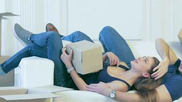 Lying among the boxes in an empty apartment video