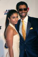 Manuela Testonini  Eric Benet arriving at Music Cares Man of the Year Dinner honoring Neil Diamond at the Los Angeles Convention Center in Los Angeles CA on February 6 2009 photo