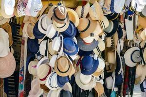 many hats are displayed in a market photo