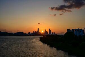 The night view of the city of Yeouido, a high-rise building, shot at Dongjak Bridge in Seoul at sunset photo