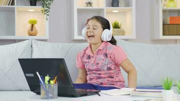 Girl child listens to music. video