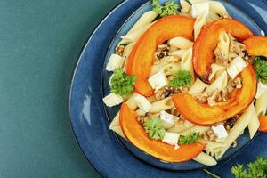 Pasta with pumpkin, autumn meal. photo